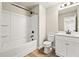 Bathroom featuring a white vanity, tub and shower combination and wood look floors at 3114 Thicket Ln, Atlanta, GA 30349