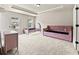Bedroom features neutral walls and carpets, tray ceiling and pink furniture at 3114 Thicket Ln, Atlanta, GA 30349