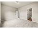 Spacious bedroom features neutral walls and plush carpet, with an attached bath for convenience at 3114 Thicket Ln, Atlanta, GA 30349