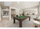 Upstairs game room features pool table and a sitting area with view to downstairs at 3114 Thicket Ln, Atlanta, GA 30349