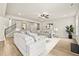 Spacious living room features neutral tones, a ceiling fan, and seamless access to other living spaces at 3114 Thicket Ln, Atlanta, GA 30349
