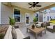 Relaxing outdoor patio features ceiling fan and furniture for enjoying the backyard at 3114 Thicket Ln, Atlanta, GA 30349