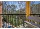 Cozy balcony with bench seating and wrought iron railing overlooking lush greenery and mature trees at 424 Lindbergh Ne Dr # 201, Atlanta, GA 30305