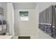 Bright bathroom featuring a tub and shower combination, white tile, and a window for natural light at 424 Lindbergh Ne Dr # 201, Atlanta, GA 30305