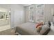 Welcoming bedroom featuring neutral carpet, shutters, ceiling fan and ensuite bath at 424 Lindbergh Ne Dr # 201, Atlanta, GA 30305