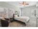 Serene bedroom with ceiling fan, ample natural light from shuttered windows, and plush carpeting at 424 Lindbergh Ne Dr # 201, Atlanta, GA 30305