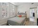 Cozy bedroom with neutral tones, plantation shutters, and stylish decor at 424 Lindbergh Ne Dr # 201, Atlanta, GA 30305