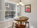 Cozy breakfast nook with a round table, three chairs, and large windows with shutters at 424 Lindbergh Ne Dr # 201, Atlanta, GA 30305
