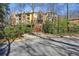 Multi-story condo building with a bridge and staircase walkway at 424 Lindbergh Ne Dr # 201, Atlanta, GA 30305