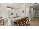 Bright kitchen with a large island, granite countertops, white cabinets, and stainless steel appliances at 424 Lindbergh Ne Dr # 201, Atlanta, GA 30305