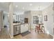 Kitchen featuring an island with a sink, bar seating, and stainless steel appliances, open to the living area at 424 Lindbergh Ne Dr # 201, Atlanta, GA 30305