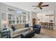 Inviting living room with large windows, shutters, modern decor, and hardwood floors at 424 Lindbergh Ne Dr # 201, Atlanta, GA 30305