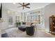 Comfortable living room featuring a fireplace, large windows, shutters, and stylish furnishings at 424 Lindbergh Ne Dr # 201, Atlanta, GA 30305