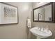 Half bath featuring a pedestal sink, framed artwork, and an ornate mirror at 424 Lindbergh Ne Dr # 201, Atlanta, GA 30305