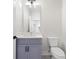 Bathroom featuring a vanity, framed mirror, and toilet at 622 Bellemeade Nw Ave # 3, Atlanta, GA 30318
