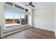 Bright, open bedroom with hardwood floors, a ceiling fan, a large sliding glass door leading to a deck at 622 Bellemeade Nw Ave # 3, Atlanta, GA 30318