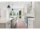 Modern kitchen featuring a large window, stainless-steel appliances, and a kitchen island at 622 Bellemeade Nw Ave # 3, Atlanta, GA 30318