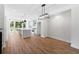 Bright, open-concept kitchen with stainless appliances, eat-in island, and hardwood floors at 622 Bellemeade Nw Ave # 3, Atlanta, GA 30318