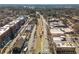 Aerial view of a vibrant downtown area, showing storefronts, traffic, and pedestrian activity at 219 Dawson Dr, Woodstock, GA 30188