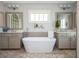 Bright bathroom features double vanity, soaking tub, and large arched mirror at 219 Dawson Dr, Woodstock, GA 30188