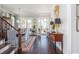 Open-concept dining area featuring hardwood floors, chandelier, and french doors to the outside at 219 Dawson Dr, Woodstock, GA 30188