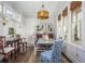 Bright dining room has a traditional design with natural light, stylish furnishings, and an inviting atmosphere at 219 Dawson Dr, Woodstock, GA 30188