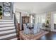 Elegant dining room adjacent to stairs features a large table, stylish decor, and an inviting ambiance at 219 Dawson Dr, Woodstock, GA 30188