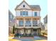 Beautiful two-story home with double front porches, brick facade, and mature landscaping creating a welcoming ambiance at 219 Dawson Dr, Woodstock, GA 30188