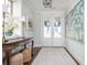 Inviting foyer with classic decor, a patterned rug, and ample natural light at 219 Dawson Dr, Woodstock, GA 30188