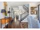 Elegant foyer showcases hardwood floors, staircase, and tasteful decor, creating a welcoming entrance at 219 Dawson Dr, Woodstock, GA 30188