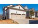 Spacious two-car garage with a wide driveway and clean, modern design at 219 Dawson Dr, Woodstock, GA 30188