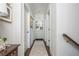 Hallway with hardwood floors, crisp white paint, and built-in cabinetry at 219 Dawson Dr, Woodstock, GA 30188