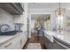 Well-appointed kitchen features marble countertops, modern appliances, and an open design leading to the dining area at 219 Dawson Dr, Woodstock, GA 30188