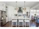 Bright kitchen with gray cabinets, white countertops, and stainless steel appliances at 219 Dawson Dr, Woodstock, GA 30188