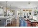 Bright living space with a kitchen bar, a fireplace and sophisticated decorations at 219 Dawson Dr, Woodstock, GA 30188
