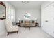 Neutral Living Room featuring stylish furniture, decor, and plantation shutters at 219 Dawson Dr, Woodstock, GA 30188