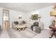 Cozy living room with a sectional sofa, unique decor, and neutral color palette at 219 Dawson Dr, Woodstock, GA 30188