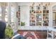 Sun-drenched office features custom built-in shelving, bright white trim, and large windows at 219 Dawson Dr, Woodstock, GA 30188