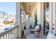 Relaxing front porch with comfortable seating, stylish decor, and view of neighborhood at 219 Dawson Dr, Woodstock, GA 30188