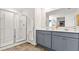 Modern bathroom featuring a glass enclosed shower, double sink vanity, and neutral tones at 2427 Bayberry St, Acworth, GA 30101