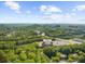 Lovely aerial view of surrounding trees, buildings, parking lot, and a glimpse of the city at 2707 Cumberland Se Ct, Smyrna, GA 30080