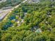 Aerial view of a community nestled among lush trees, showcasing its prime location at 2707 Cumberland Se Ct, Smyrna, GA 30080