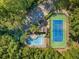 Aerial view of a community pool and tennis court, surrounded by lush trees at 2707 Cumberland Se Ct, Smyrna, GA 30080