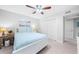 Cozy bedroom featuring a white bed frame, ceiling fan, and closet space at 2707 Cumberland Se Ct, Smyrna, GA 30080
