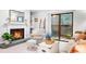 Cozy living room with fireplace, mantle mirror, and access to a balcony at 2707 Cumberland Se Ct, Smyrna, GA 30080