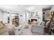 Open living room showcasing the fireplace and views to the kitchen, creating an inviting atmosphere at 2707 Cumberland Se Ct, Smyrna, GA 30080