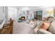 Cozy living room with fireplace, mantle mirror, and access to a balcony at 2707 Cumberland Se Ct, Smyrna, GA 30080