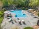 Inviting community pool area with lounge chairs, tables, umbrellas, and well-maintained landscaping at 2707 Cumberland Se Ct, Smyrna, GA 30080