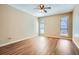Bedroom featuring wood flooring, a ceiling fan, and windows that provide natural light at 3852 Woodridge Way, Tucker, GA 30084