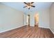 Bedroom showing a ceiling fan and doorways to the hall and to the bathroom at 3852 Woodridge Way, Tucker, GA 30084